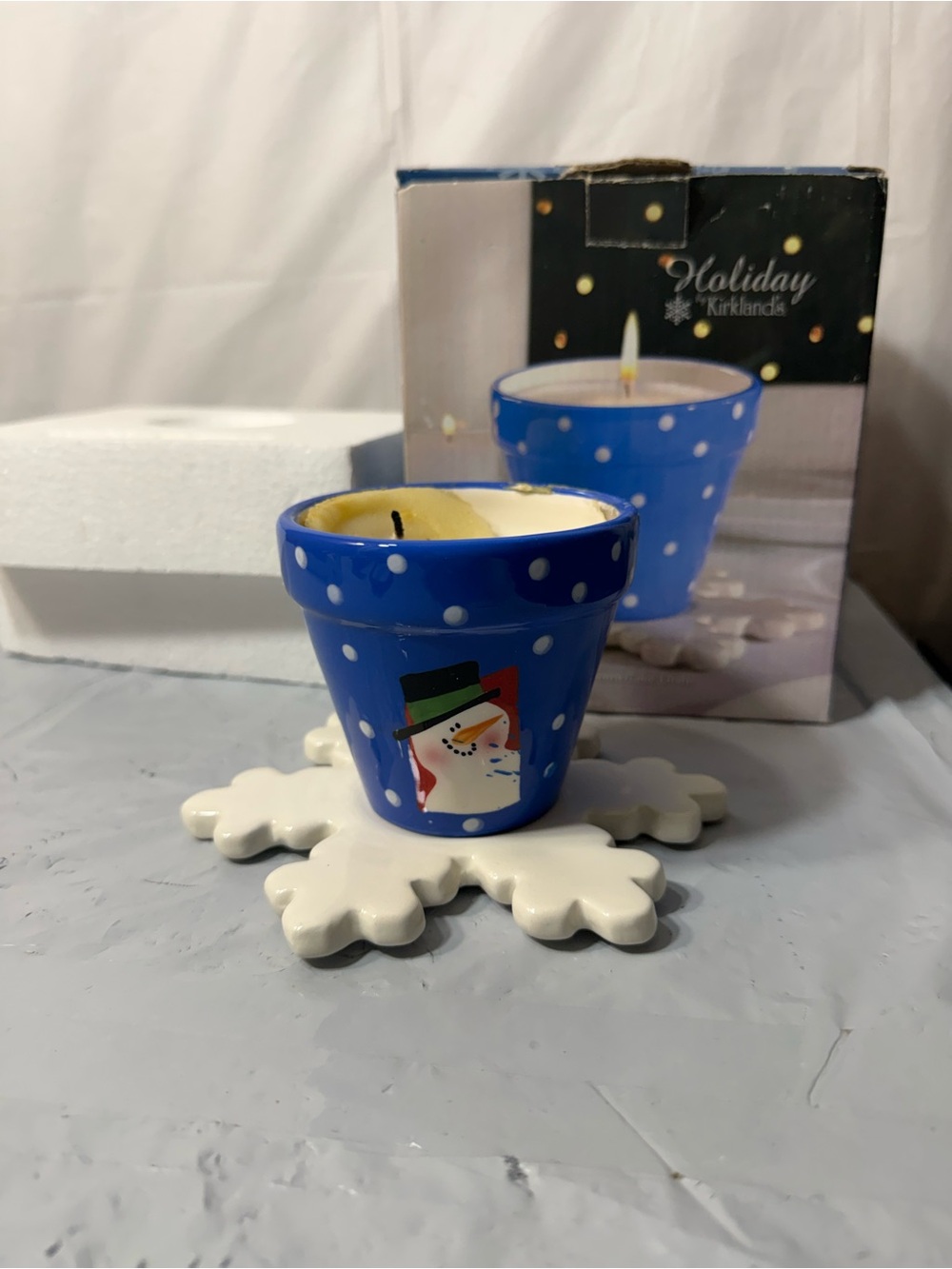 Kirkland's holiday scented candle in a blue polka dot ceramic pot